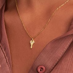 Unlock the charm of delicate accessorizing with our 'Tiny Key Necklace.' Crafted in lustrous gold, this petite pendant mimics an enchanting key, a timeless symbol of discovery and freedom. Whether worn alone or layered with other pieces, it adds a sprinkle of whimsy and mystery to your look. A delightful piece to unlock your style potential.  14k gold plated over sterling silver and high-quality cubic Zicornia.  Hypoallergenic, nickel and lead-free. Tarnish resistant. H2O sensitive. Recommend taking it off during shower and restoring in the pouch that comes with the pacakge. Key Pendant Necklace, Timeless Symbol, September Birthstone Jewelry, August Birthstone Jewelry, July Birthstone Jewelry, Necklace Craft, Zodiac Jewelry, Key Necklace, Jewelry Ring Box