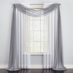 an open window with sheer curtains hanging on the wall and hardwood flooring in front of it