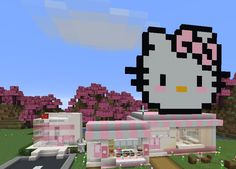 a hello kitty house is shown in this minecraft video game screengrace, it appears to be pink and white