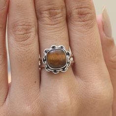 "Tiger Eye Ring / 925 Sterling Silver Ring / Cushion Gemstone Ring / Minimalist Jewelry / Handmade Ring / Personalized gift. Gemstone Name -Tiger Eye  Stone Quality - AAA Ring Wight - 4.33 gm Ring Length - 1.4 cm  Ring Width -   1.4 cm Ring Size - All Ring Size Available. All Our Jewelry Is Stamped 925 . You'll get the exact product as shown in the pictures We serve complete 925 sterling silver Jewelry and genuine properties of the stone. The products are dispatched from the small business from USA. Product Quality and Packaging - Our all products are 925 Silver Stamped which shows that the product is genuine and authentic .The products are dispatched from the small business from USA so you get the product on time and the product packaging comes in bubble foil wrap with all the precautions Adjustable Sterling Silver Stackable Rings With Natural Stones, Minimalist Natural Stone Rings For Everyday, Sterling Silver Gemstone Midi Rings, Sterling Silver Open Ring With Gemstone, Sterling Silver Gemstone Midi Rings With Open Design, Minimalist Rings With Natural Stones, Everyday Brown Sterling Silver Jewelry, Adjustable Sterling Silver Gemstone Midi Rings, Adjustable Sterling Silver Midi Rings With Gemstones