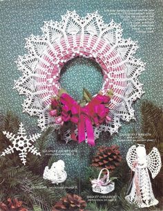 a crocheted christmas wreath with pink bows and pine cones on the front cover