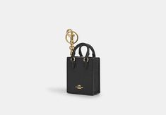 North/South Mini Tote Bag Charm | COACH OUTLET 2024 Wishlist, Coach Outlet, Mini Tote Bag, North South, Mini Tote, Shoe Shop, Key Ring, Belt Bag, Snap Closure