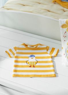 Details: Available in Sizes: 1-12 months Style#1003 Material and Care: Shirt: 95% Cotton, 5% Elastane Patterns may vary. Materials may have natural variations. Colors may vary from different viewing devices. Playful Striped T-shirt For Spring, Cute Yellow T-shirt For Playtime, Cotton Tops With Cartoon Print For Spring, Playful Cartoon Print Tops For Spring, Playful Striped Cotton Tops, Spring Crew Neck Tops For Playtime, Crew Neck Tops For Playtime In Spring, Playful Cotton Summer Shirt, Crew Neck Tops For Spring Playtime