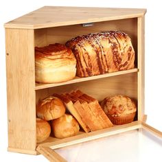 a wooden shelf filled with lots of different types of bread