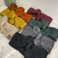 Welcome to the cozy world of Bow'Ho & Co, where style meets comfort! Introducing our Super Soft Warm Knit Bow Headbands, the perfect blend of bohemian charm and practical warmth. Each headband is crafted with love using the softest acrylic yarn, ensuring a gentle, itch-free experience for all-day wear. Available in a spectrum of 7 gorgeous hues - taupe, evergreen, black, gray, rust, plum, and mustard - these headbands add a pop of color to any outfit. Measuring 3 inches wide, they comfortably fit 20 to 23 inches in circumference for adults and 16 to 19 inches for kids. Plus, for those needing a custom size, we're happy to accommodate at no extra charge. Just message us your requirements! Not just a pretty accessory, these headbands are adorned with a chic faux leather tag, adding a touch o Outdoor Cafe, Boho Look, Tumble Dryer, Bow Headband, Jewelry Earrings Hoops, Acrylic Yarn, Multi Color, Color Pop, Jewelry Earrings