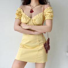 A romantic French style dress with a bustier design and playful puff sleeves. Centre-piece tie with a flattering high-waist cinch silhouette. Available in Goose Yellow. White & Black. Details: 97% Cotton / 3% Spandex Cold Hand Wash / Cool Iron Handmade pieces will take 2-4 weeks to dispatch Size / Fit: Length is measured from centre back Runs small Model wears a Small Model Info: Chest 82 cm Waist 65 cm Hips 88 cm Height 165 cm SIZE CHART Bust Waist Length Small 70 cm 62 cm 78 cm Medium 74 cm 66 Fitted Mini Dress With Lantern Sleeves For Summer, Fitted Puff Sleeve Dress With Ruffles And Sweetheart Neckline, Summer Mini Dress With Fitted Lantern Sleeves, Fitted Corset Dress With Ruched Puff Sleeves, Flirty Puff Sleeve Dress With Ruffles And Square Neck, Flirty Puff Sleeve Dress With Sweetheart Neckline For Summer, Flirty Summer Puff Sleeve Dress With Sweetheart Neckline, Fitted Off-shoulder Puff Sleeve Dress With Ruffles, Fitted Off-shoulder Puff Sleeve Dress For Brunch