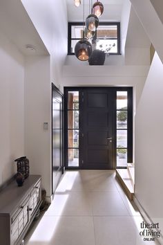 the hallway is clean and ready to be used as an entrance way for someone's home