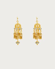 These retro drop earrings are reminiscent of traditional jhumka earrings, crafted like tiny cages holding mysterious little elves. Their delicate, intricate parts make crispy, subtle whispers by your ears. They catch the light as they sway with your every move, sprinkling shimmering sparkles on your skin. Hey, actually, wearing them makes you look as delightful as an elf! 🧚💛 Materials: 18k gold plated brass Measurement: 52mm/2.04" in length, 16mm/0.63" in width Brass Bridal Earrings For Festivals And Celebrations, Ceremonial Drop Earrings, Elegant Danglers With Dangling Beads For Festivals, Elegant Danglers With Beads For Festivals, Elegant Festival Danglers With Beads, Festive Brass Pierced Plug Earrings, Festive Dangling Beads Drop Earrings, Festival Brass Drop Jhumkas, Festive Drop Earrings With Dangling Beads