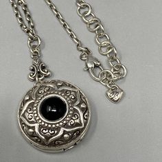 Brighton Locket Necklace Silver Plated Black Cabochon Round Sunflower Chain 20" Black Adjustable Flower Pendant Necklace, Adjustable Black Flower Pendant Necklace, Black Metal Necklace With Locket, Elegant Black Medallion Locket Necklace, Black Metal Medallion Jewelry, Black Medallion Metal Jewelry, Vintage Black Charm Necklace As A Gift, Metal Locket Necklace With Round Pendant, Vintage Black Charm Necklace For Gift