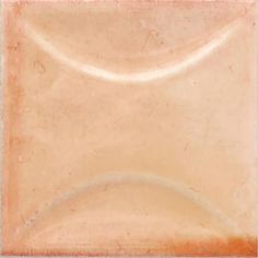 an orange and white square shaped tile