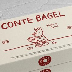 a box of conte - bagel sitting on top of a table