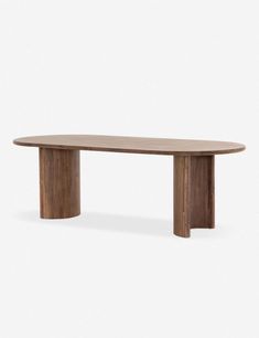 a wooden table sitting on top of a white floor