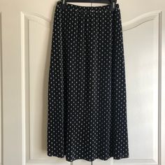 Blue Skirt With Cream Poke A Dots. It’s Pleated With Elastic Waist. This Skirt Has Never Been Worn. Spring Polka Dot Long Skirt, Polka Dot Long Skirt For Spring, Casual Polka Dot Pleated Skirt, Casual Long Polka Dot Skirt, Casual Polka Dot Skirt With Elastic Waistband, Casual Polka Dot Lined Skirt, Chic Polka Dot Long Skirt, Polka Dot Lined Skirt Bottoms For Day Out, Casual Polka Dot Flowy Skirt