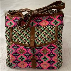 Beautiful Crossbody Bag. Colors: Brown, Pink, Green And Purple. Top Zipper Closure. Front, Pocket With Locker. Back, Zipper Pocket. 3 Pockets Inside And 1 Pocket With Zipper. Long Adjustable Strap. Product Dimensions (L X W X H) 10.50 X 10.50 X 2.00 Inches Casual Pink Bag With Mobile Phone Pocket, Casual Pink Pouch Shoulder Bag, Casual Pink Satchel, Pink Casual Satchel For Summer, Casual Pink Satchel For Summer, Trendy Pink Crossbody Shoulder Bag, Casual Pink Satchel With Removable Pouch, Casual Pink Bag With Adjustable Strap, Trendy Pink Shoulder Bag With Adjustable Strap