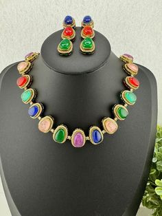 This is a beautiful Premium quality American Diamond and multicolor Doublet and Monalisa stones necklace set with matching long earrings and has amazing shine. This is so beautiful to look at and a perfect one for weddings and parties. Color : gold, multicolor Necklace length : 16+ inches (collar necklace length, chain closure) Necklace width :  Earring length : 2 inch Earring width : 0.5 inch Each Earring Weight: 8.9 Grams Material : Brass, Doublet stones, Monalisa stones, CZ Beautiful High Qua Oval Multicolor Jewelry For Formal Occasions, Formal Multicolor Gemstone Accented Jewelry, Formal Multicolor Gemstone Jewelry, Multicolor Stones Jewelry For Celebrations, Multicolor Stone Jewelry For Celebration, Multicolor Jeweled Formal Jewelry, Formal Multicolor Jeweled Necklaces, Formal Multicolor Jeweled Necklace, Elegant Multicolor Multi-stone Jewelry Sets