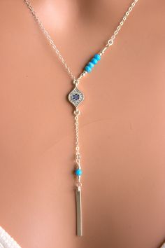 "This is a 925 sterling silver, multi strand Evil Eye Lariat Y style necklace! Genuine turquoise gemstones 3-4mm make this double strand necklace stunning! Necklace has a shorter choker length chain and a longer Y style chain with an evil eye center pendant with small pave blue crystals. A 1\" sterling silver bar pendant with a turquoise gemstone hangs from drop. Drop measures 3\" with bar pendant.ds This is stunning statement piece, makes a great gift for that unique lady! Comes nicely boxed, f 14kt Gold Jewelry, Lariat Necklaces, Necklaces Blue, Eye Center, Clean Sterling Silver, Necklace Ideas, Double Strand Necklace, Clover Earrings, Clover Necklace