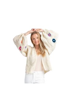 Show off chic retro style with this relaxed-fitting cardigan beautifully crocheted with slouchy balloon sleeves and colorful flowers. 22 1/2" length Open front Long sleeves Crocheted construction Cropped 100% acrylic Hand wash, dry flat Imported Model stats: 5'10" height, 32" bust, 25" waist, 36" hip. Model is wearing size OS. Spring Knit Sweater With Balloon Sleeves, Knit Sweater With Balloon Sleeves For Spring, Knit Balloon Sleeve Sweater For Spring, Spring Balloon Sleeve Knit Sweater, Trendy Crochet Cardigan For Spring, Spring Cream Crochet Cardigan, Floral Crochet, Cropped Cardigan, Front Open