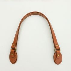 "This listing is for ONE pair of 23.5\" inch sew-in PU leather bag handles for bag making (Two single straps).  The bag handles come with sewing holes on the attachment tap. Size specification: Length: Approximately 23.5\" / 60cm Strap Width: 2cm Strap end (attachment tap): 6.7cm (L) x 4cm (W) Material: PU Leather / Faux Leather with bronze colour metal hardware Colour: Tan / Camel Any questions, please send us a convo or email us at hello@purple-stitches.com Thank you very much. ** UK CUSTOMER Sewing Holes, Bronze Colour, Longchamp Bag, Pu Leather Bag, Women Purse, Handbag Handles, Strap Bag, Purse Crossbody, Handbag Straps