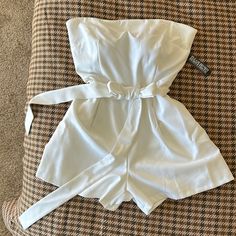 Nwt White Strapless Romper By Ny&Co. The Top Has A Strip Inside To Keep It From Slipping. Flat Lay Measurements Pit To Pit: 18” Waist: 16.5” Length: 24.5” Spring Strapless Jumpsuits And Rompers For Going Out, Strapless Jumpsuits And Rompers For Spring Going Out, Strapless High Waist Jumpsuit For Summer Date Night, White Strapless Jumpsuit For Summer Nights, White Strapless Jumpsuit For Night Out In Summer, Summer Strapless Solid Color Jumpsuit For Going Out, White Bandeau Strapless Jumpsuit For Summer, Strapless Jumpsuit For Going Out In Summer, Fitted Strapless Jumpsuit For Summer Outings