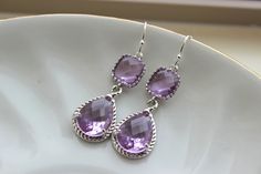 READY TO SHIP! Silver Lavender Earrings Lilac Purple Jewelry Teardrop Glass Two Tier Earrings Bridesmaid Earrings Wedding Earrings Lavender Wedding Jewelry The lavender teardrop measures overall 19mm by 12mm (including the loop). The glass in the middle of the teardrop measures 13mm by 10mm by 6mm. The lavender block measures 9mm with 3mm thickness and is silver plated. The earwire is sterling silver. The length of the earrings is a little over 1.5 inches long. These earrings are simply stunning Lavender Dangle Earrings For Wedding, Purple Teardrop Earrings For Wedding, Purple Dangle Teardrop Earrings For Wedding, Purple Teardrop Drop Earrings For Formal Occasions, Purple Drop Teardrop Earrings For Formal Occasions, Purple Wedding Teardrop Earrings, Lavender Drop Earrings For Wedding, Purple Dangle Bridal Earrings For Wedding, Purple Lilac Wedding