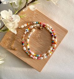 It is a handmade and colorful pearl necklace made of Miyuki and freshwater pearls. 🌸 It can be perfectly combined with simple outfits or makes a colorful statement 💌. Of course, it is also the perfect gift idea for you or your loved ones.  The necklace in pastel: https://www.etsy.com/de/listing/1163669569/handgemachte-bunte-halskette-in The bracelet looks great too! :) https://www.etsy.com/de/listing/1241794829/aruba-handgemachte-perlenarmbander-in If you want a different length, please write to me! :) DESCRIPTION: Tired of boring jewelry? Perfect - this cute & colorful necklace is a perfect eye-catcher for everyone. 💖 Choose your own clasp color and start creating your new favorite necklace! Note: If you choose "silver" as the clasp color, for example, the spacer beads will also be sil Colorful Pearl Necklace, Handmade Pearl Jewelry, Pearl Jewelry Gift, Colorful Necklace, Necklace Colorful, Summer Necklace, Colourful Necklace, Affordable Jewelry, Aruba