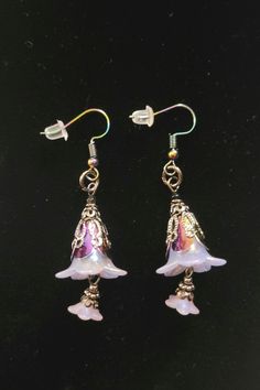 Magical purple flower drop earrings. The flower is made from mixed metals while the hooks are 100% iron. The hooks are also nickle free. Flower Drop Earrings, Purple Flower, Mixed Metals, Purple Flowers, Favorite Jewelry, Jewelry Earrings Dangle, Dangle Drop Earrings, Violet, Dangle Earrings