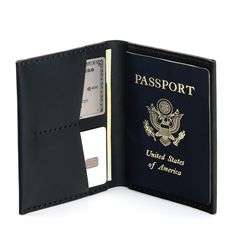 an open passport case with a credit card in it