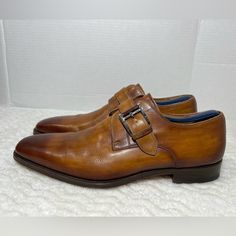 Magnanni 'Marco' Monk Strap Cuero Loafer Slip On Shoe Brown 13276 Size 9.5m Euc. Shoes Is In Used Condition And Has Signs Of Wear. Right Pair Has A Small Scratch On The Front Side. Beside That Shoes Is In Great Condition. Upper Leather Is In Great Condition And Very Clean, Inside Is Super Clean And The Soles Are In Great Condition. Nice Comfortable Italian Shoes For Casual Wear Or Business Wear. Condition Is Pre-Owned. Shipped With Usps Priority Mail. Sold As Pictures. Thank You! Feel Free To Message Me For Any Questions. Thank You Designer Monk Strap Slip-on Shoes For Semi-formal Occasions, Business Casual Monk Strap Shoes With Branded Insole, Semi-formal Slip-on Monk Strap Shoes With Stitched Sole, Semi-formal Almond Toe Monk Strap Shoes With Stitched Sole, Formal Monk Strap Shoes With Stitched Sole, Designer Semi-formal Slip-on Monk Strap Shoes, Designer Slip-on Monk Strap Shoes With Leather Sole, Monk Strap Shoes With Branded Insole For Semi-formal, Designer Monk Strap Slip-on Shoes With Leather Sole