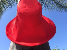 "Red is symbolic of love - this sunhat will make a great Valentine's Gift And you can personalize this hat by selecting the size for either your significant other, friend, or yourself A little pop of color to complete any outfit - brilliant red wide brim sun hat. A gorgeous shade of red makes any outfit come alive and here you have a very beautiful wide brim sun hat in stunning red. The sunhat has a very chic look to it because of its very wide brim and yet it is very functional by providing sun Red Fedora Sun Hat For Spring, Red Fedora Hat For Vacation, Adjustable Red Hats For Holiday, Red Fedora Vacation Hat, Adjustable Red Hat For Holiday, Adjustable Red Sun Hat For Summer, Red Short Brim Hat For Vacation, Red Bucket Hat For Festivals, Red Wide Brim Hat For Vacation