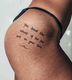 the back of a woman's thigh with writing on it that says, you have the wings of the sea and on your stomach