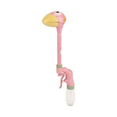 the pink flamingo is standing up with its head turned to look like it's holding