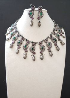 High quality Indian oxidized silver collar bib neckalce with sparkly CZ stones, pearls. Perfect for any party or evening gathering. Wear your hair up or down. The metal is a soft grey color, shined to a soft lustre, to better show off the sparkly stones. Overall effect is stunning! An elegant design that is flattering on everyone! Suspended from a detailed floral chain. Matching earrings. Excellent finish and craftsmanship. Shop necklaces: https://www.etsy.com/shop/BoutiqueByMaryam?section_id=21 Silver Jeweled Jewelry Sets For Celebration, Festive Silver Jeweled Jewelry Sets, Festive Jeweled Silver Jewelry Sets, Bollywood Style Jewelry With Oxidized Finish For Party, Bohemian Silver Jewelry Sets With Stone Work, Silver Jeweled Necklaces For Celebration, Silver Jeweled Necklace For Celebration, Heavy Metal Necklaces For Parties, Bohemian Silver Kundan Necklace With Stone Work