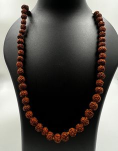 Immerse yourself in the sacred energy of our meticulously crafted Rudraksha Mala featuring 7mm beads. Handcrafted from authentic Rudraksha seeds, each bead carries a rich history of spiritual significance. Rudraksha beads are revered for their ability to enhance meditation, promote mindfulness, and attract positive energies. Key Features: Authentic Rudraksha Seeds: Sourced with care, each 7mm bead is a genuine Rudraksha seed, known for its powerful spiritual vibrations. Meticulous Craftsmanship: Our Rudraksha Mala is handcrafted with precision, ensuring the integrity of each bead and the overall aesthetic appeal of the necklace. Versatile Meditation Aid: The 7mm bead size strikes a perfect balance, making this mala ideal for both beginners and experienced practitioners. Use it for meditati Handmade Spiritual Mala, Handmade Spiritual Mala For Rituals, Spiritual Necklaces With 108 Beads For Rituals, 8mm Spiritual Beads For Meditation, Spiritual Polished Beads For Meditation, Spiritual Jewelry With Gemstone Beads For Festivals, Spiritual Necklaces With 8mm Beads For Rituals, Holistic Jewelry With 108 Beads For Rituals, Holistic Necklaces With 8mm Beads For Rituals