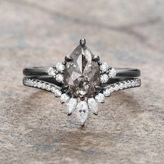 an engagement ring with two pear shaped diamonds