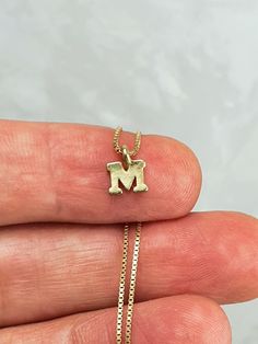 "Delicate and simple sterling silver initial letter necklace, it is perfect if you want a personalized gift for a friend, sister, mother, daugther or for yourself. So beautiful, cute and mini. Necklace and letter are made of 925 sterling silver. Pendant size is 5mm * Gold initials are made of bronze and plated with 18Kt gold. * 925 Sterling silver box chain plated with 18 kt gold. Our jewelry is packaged in a beautiful gift box. If this necklace is a gift, we can ship to third party. Send me a m Initial Letter Necklace, Mini Necklace, Sterling Silver Initial, Jewelry Bridesmaid, Etsy Bridesmaid Gifts, Gold Initial, Silver Box, Initial Letter, Necklace Personalized