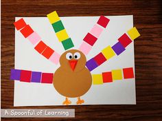 a paper turkey with colored strips on it