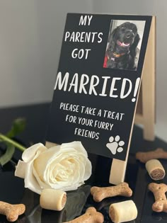 a sign that says, my parents got married please take a treat for your furry friends