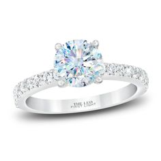 a white gold engagement ring with diamonds on it