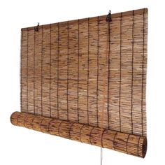 the bamboo blinds are hanging on the wall