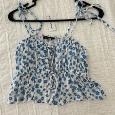 Kendall & Kylie Blue And White Blouse From Pacsun. Has Adjustable Straps And Has Open Front Design Blue Tops For Beach Season Brunch, Blue Tops For Brunch During Beach Season, Light Blue Printed Summer Top, Floral Print Tops For Beach Season Day Out, Blue Crop Top Blouse For Summer, Blue Printed Tank Top For Summer, Light Blue Summer Blouse For Vacation, Light Blue Tops For Spring Vacation, Light Blue Blouse For Summer Vacation