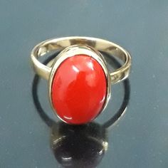 Birthstone Jewelry Custom Jewelry Ring metal is High Quality Solid 925 Sterling Silver Stone- Natural Red Coral Stone Shape- Oval Stone Size - 10x12 mm Stone Weight- 6.20 Carat Setting Type- Halo Bezel Ring Band- Gold Gems Stone Color- Red good looking small n shiny finished ring looks amazing design The humble ring has been about for years, older than any of us and still as important as ever. A symbol of eternal love, You can personalize it with your desired birthstone.This ring is perfect to w Oval Spiritual Ring With Polished Finish, Oval Spiritual Rings With Polished Finish, Dome Ring With Gemstone As Gift, Gemstone Dome Ring As Gift, Gemstone Dome Ring With Round Band As Gift, Gemstone Dome Ring With Round Band For Gift, Spiritual Gemstone Signet Ring For Anniversary, Spiritual Style Anniversary Ring With Round Stone, Heirloom Dome Ring With Bezel Setting As Gift