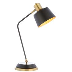 a black and gold desk lamp on a white background, with the light turned off