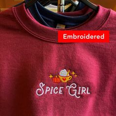 "*SIZES ARE UNISEX* -I'd suggest your usual size for a regular fit, or sizing up for a more relaxed fit. *these sweatshirts are extra comfy when oversized ☕️ \"Spice Girl\" embroidered on a cozy cute fall crewneck. Perfect for all the pumpkin spice lovers! A sturdy and warm sweatshirt bound to keep you warm in the colder months. A pre-shrunk, classic fit sweater that's made with air-jet spun yarn for a soft feel and reduced pilling. Your new favorite sweatshirt! * 50% cotton, 50% polyester * Pre Long Sleeve T-shirt With Embroidered Graphics For Fall, Casual Embroidered Fall T-shirt, Casual Embroidered T-shirt For Fall, Casual Fleece T-shirt For Fall, Cute Crew Neck Sweater With Embroidered Logo, Cute Custom Embroidered Tops For Fall, Cute Tops With Custom Embroidery For Fall, Long Sleeve T-shirt With Embroidered Logo For Fall, Crew Cotton Sweater For Fall