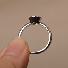 This is a gorgeous handmade creation. Its beauty is its simplicity & Elegance. The 7*7mm round cut lab green sapphire is crafted in solid sterling silver / 14k gold. It is available to customized, if you have any mind, just let me know, we will discuss with it. All item is sent in a beautiful gift box You can realize more lovely stuff clicking the link https://www.etsy.com/shop/knightjewelry?refshopsection_shophome_leftnav Please leave the correct address and you PHONE NUMBER for delivering Emerald Solitaire Promise Ring, Modern Solitaire Emerald Ring With Round Cut, Emerald Ring With Bezel Setting, Formal Emerald Ring With Tension Setting For May Birthstone, Minimalist Sapphire Ring With Prong Setting, Sterling Silver Emerald Ring With Bezel Setting, Solitaire Round Emerald Ring For Promise, Minimalist Round Cut Sapphire Ring With Prong Setting, Tourmaline Round Cut Jewelry With Prong Setting