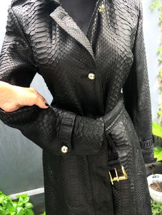 The BLACK SNAKESKIN LEATHER COAT is one of the jewels of the outerwear collection. ⠀ A coat of laconic design with a unique texture of snakeskin and with a magical shade - truly ROYAL LUXURY. This model was created for women who know how to emphasize nobility and impeccable taste with their style. In a python skin coat your every look will be ARISTOCRATIC and, at the same time, trendy. ⠀ We believe our coat will become one of the favorite items in your wardrobe! Outside: Genuine python leather I Luxury Leather Jacket For Work, Elegant Black Leather Jacket For Formal Occasions, Luxury Leather Evening Outerwear, Luxury Leather Outerwear For Party, Luxury Leather Party Outerwear, Luxury Leather Outerwear, Luxury Long Coat For Evening Wear, Luxury Long Coat For Evening, Designer Black Leather Jacket For Evening