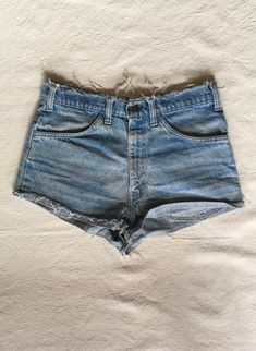 "1970s cut off jean shorts Levis 645 made in USA orange tab zip fly frayed raw waist and hem authentic age wear hem is folded up and hemmed w/fray showing label size unreadable measures, lying flat, waist-16\" rise-12\" inseam-1 hem-11\" total length-11\"" Vintage Denim Jean Shorts For Summer, Spring Vintage Distressed Bottoms, Retro Cotton Cutoff Shorts, Retro Cutoff Bottoms For Summer, Retro Cotton Jean Shorts With Frayed Hem, Retro Short Bottoms With Frayed Hem, Vintage Jean Shorts For Summer, Summer Retro Cutoff Bottoms, Vintage Distressed Denim Shorts