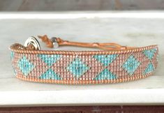 a beaded bracelet on a counter top