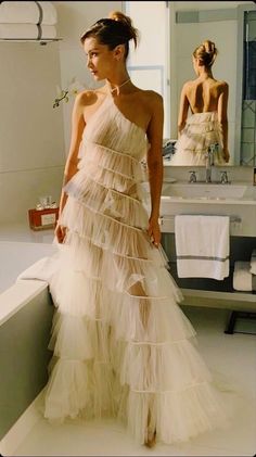 Elegant Summer Tulle Wedding Dress, Fitted One-shoulder Tulle Gown, One-shoulder Tulle Gown For Gala, Chic Strapless Gown With Sweep Train, Chic Long Gown With Sweep Train, Chic Gown With Sweep Train, One-shoulder Tulle Gala Dress, Glamorous Tulle Skirt Gown For Prom Season, Glamorous Tulle Gown For Prom Season