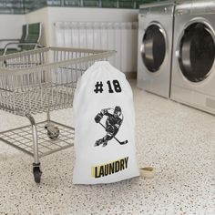 a laundry bag sitting next to a washing machine