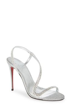 A crystal-pavé strap glides elegantly around the foot in this slingback sandal featuring glitter-dusted metallic leather and a slender stiletto heel. 4" (102mm) heel (size 38.5) Elasticized slingback strap Wipe with a soft, dry cloth and store in a dust bag Please note the red lacquer on soles will wear off as a result of normal use. To minimize the effect, avoid wearing in wet weather or on abrasive surfaces Leather upper, lining and sole Made in Italy Women's Designer Shoes Luxury Embellished Slingback Sandals, Luxury Silver Slingback Heels, Luxury Silver Sandals With Rhinestones, Luxury High Heel Glitter Sandals, Luxury Glitter Sandals With Ankle Strap, Luxury High Heel Sparkling Sandals, Silver Slingback Sandals With Heel Strap For Evening, Luxury Open Toe Sparkling Sandals, Luxury Sparkling High Heel Sandals